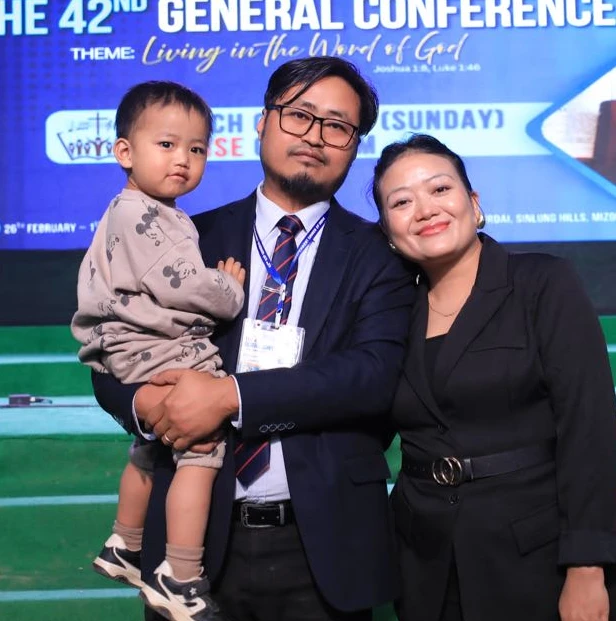 Joyful Thiek with family at a church conference